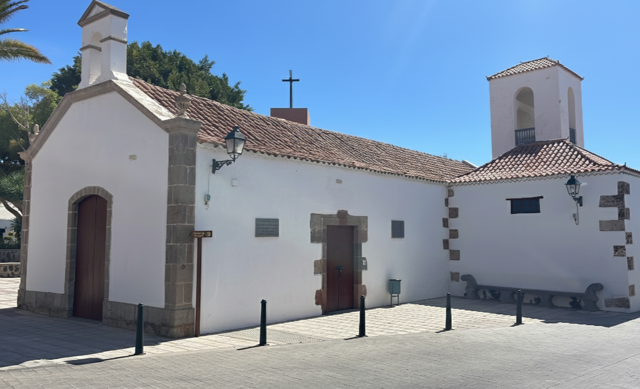Exterior of a historic white-stone church