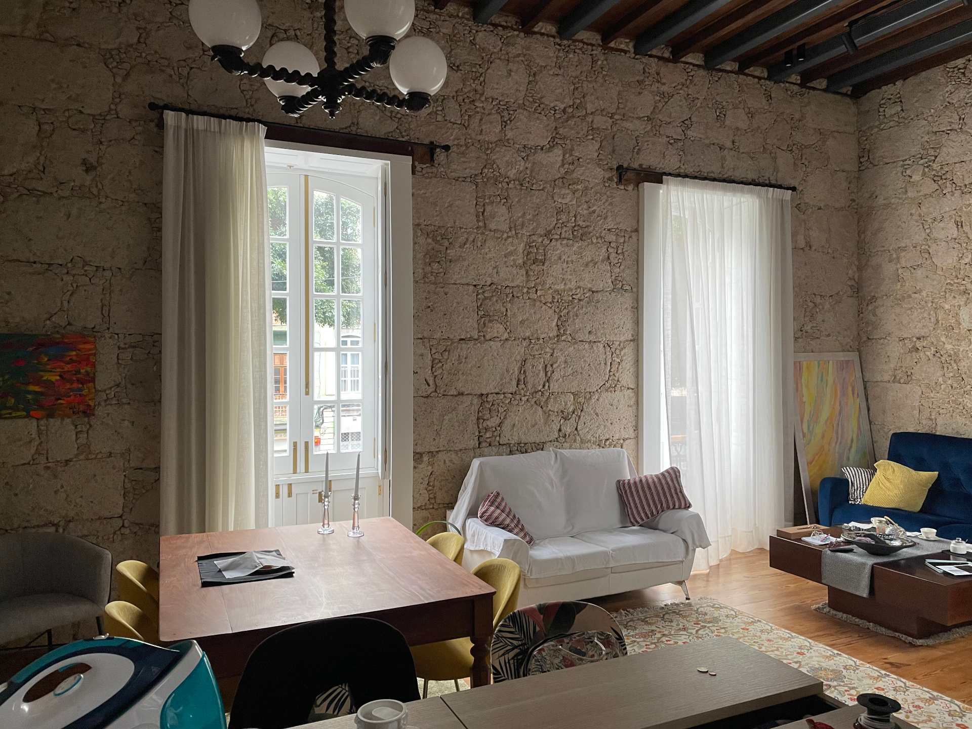 Interior with stone walls and rustic-modern furniture